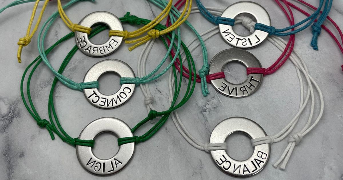 metal washers with a word stamped into them and then turned into bracelets